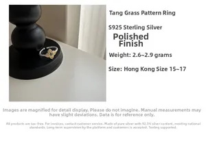 Detail of S925 sterling silver ring with gold petal inlay and Karakusa engraving