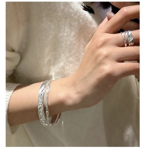 Detail of hammered texture S925 silver double layer ring and open cuff bracelet