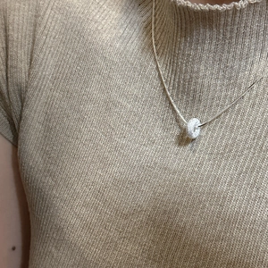 Minimalist S925 sterling silver frosted donut pendant necklace for women shown on model