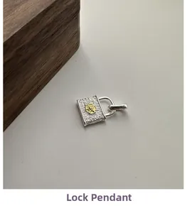 Detailed close-up of S925 sterling silver padlock pendant with floral engraving