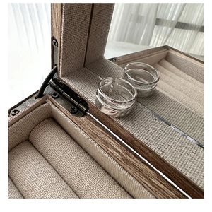 Close-up of dual-layer S925 sterling silver rings with hammered texture in a wooden box