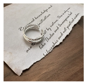 Macro detail of S925 sterling silver double-layer ring with handmade hammer texture