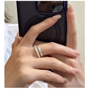 Detail of S925 sterling silver double-layer ring with textured and polished finish