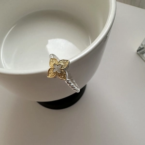 Minimalist S925 silver two-tone floral ring with gold engraved flower on white ceramic