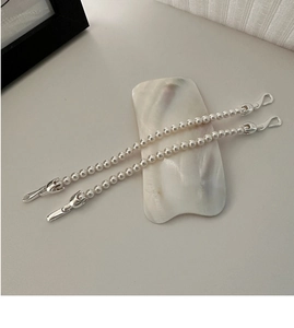 Detail of S925 sterling silver beaded necklace with buckle clasps on shell plate