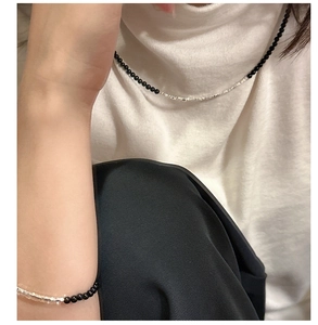 Detail of S925 sterling silver necklace and bracelet with black onyx and silver beads
