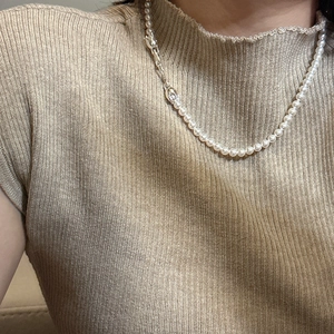 Elegant S925 sterling silver pearl necklace with clasp worn on a knitted sweater