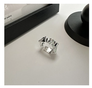 Macro shot of S925 sterling silver ring featuring irregular crushed liquid metal texture