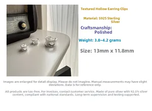 Detailed view of S925 sterling silver ear cuffs showing textured hollow design and specs