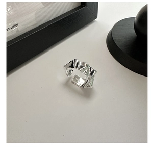 Macro shot of S925 sterling silver ring showing irregular pleated liquid metal texture