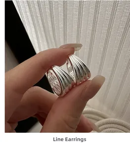 Detailed view of S925 sterling silver multilayer hoop earrings with S925 hallmark