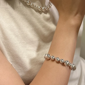 Elegant S925 sterling silver beaded bracelet and necklace set worn on a model