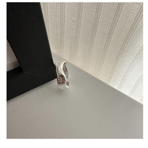 Detail view of S925 sterling silver ring with engraved freedom text and matte finish