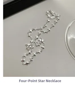Detailed close-up of S925 sterling silver star necklace with lobster clasp and logo tag