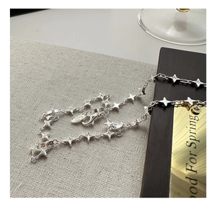 Detailed view of S925 sterling silver four-point star necklace with lobster clasp
