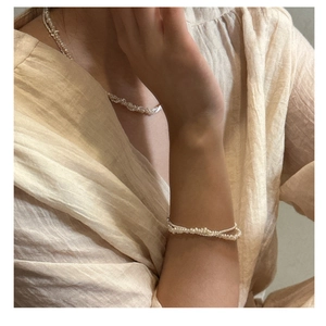 Detail of elegant S925 silver double-layered seed pearl necklace and bracelet set