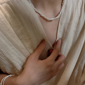 Elegant S925 silver and pearl jewelry set with twisted necklace and matching bracelet