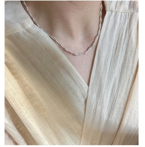 Close-up of S925 sterling silver double-layered snake chain necklace on model neck