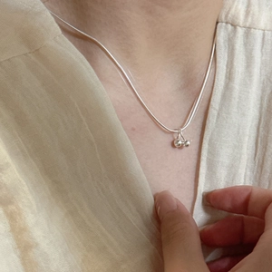 925 sterling silver cherry pendant necklace with smooth snake chain on model neck