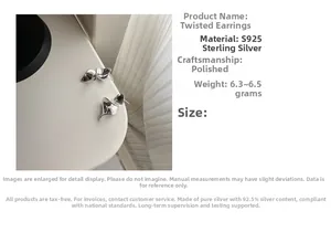 Detailed view of polished S925 sterling silver ruffled geometric hoop earrings