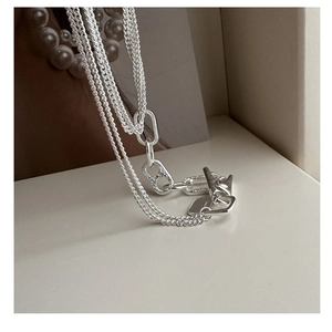 Detailed macro view of S925 sterling silver multilayer chain with chic pig nose link