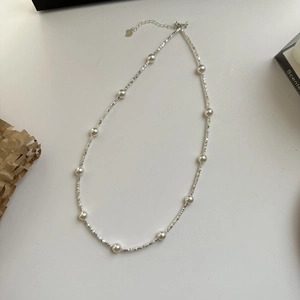 S925 sterling silver necklace featuring delicate pearls and irregular silver beads on a chain