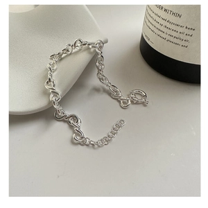 Close-up of S925 sterling silver chunky knot chain bracelet with adjustable spring clasp
