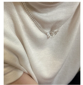 Detailed close-up of S925 sterling silver hallmark on the heart buckle chain necklace