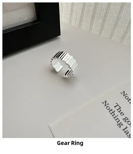 Macro shot of silver gear texture adjustable ring with vertical industrial stripes
