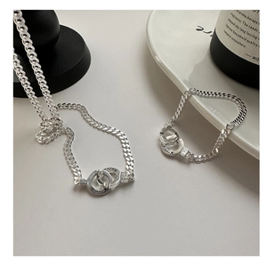 Close-up of S925 sterling silver Cuban link necklace with engraved Korea double rings
