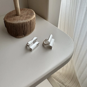 Elegant wavy geometric S925 sterling silver hoop earrings with a mirror polished finish
