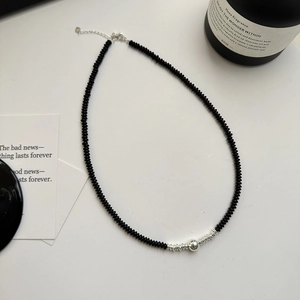 Minimalist 925 silver necklace featuring black onyx beads and a silver bead pendant