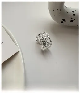Macro view of triple-layered 925 sterling silver ring featuring anchor chain links