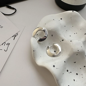 Minimalist S925 sterling silver hoop earrings with organic surface texture for women