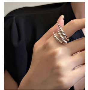 Macro shot of 925 silver multi-layer spiral ring featuring a modern criss-cross design