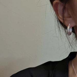 S925 sterling silver hoop earrings with vintage floral pattern on female model