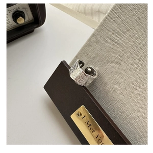 Detailed macro view of S925 sterling silver ring with engraved vintage floral patterns