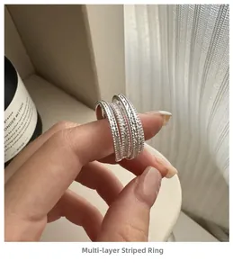 Detail of S925 sterling silver multilayer ring featuring unique hammered texture finish