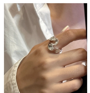 Detailed view of S925 sterling silver wavy ring with unique molten hammer texture