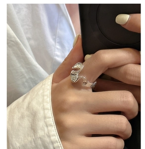 Detailed view of S925 sterling silver ring with organic wavy texture and metallic finish