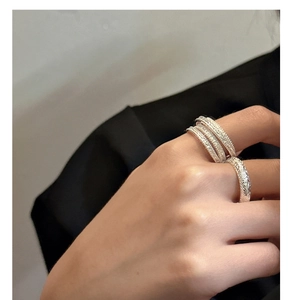 Close-up of S925 silver multi-layer stackable rings with vintage floral engravings