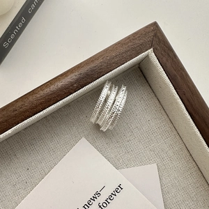 Minimalist S925 sterling silver multi-layer beaded ring on aesthetic fabric tray