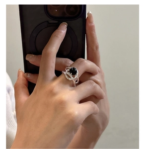 Detailed view of S925 sterling silver ring with black agate and lava texture