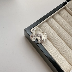 Minimalist S925 sterling silver open ring with organic wave lava texture on a jewelry box