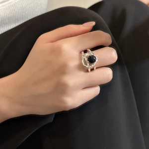 Minimalist S925 sterling silver ring with black onyx stone on a female model hand