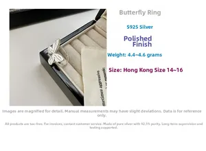 Detailed view of S925 sterling silver bow ring with texture in a black jewelry box