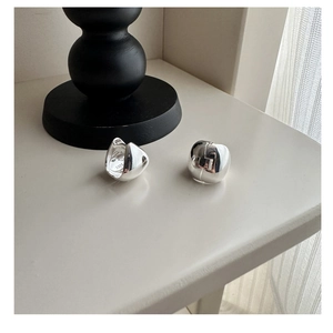 Close-up of S925 sterling silver chunky hoop earrings with high-polish mirror finish
