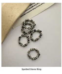 Macro shot of S925 sterling silver beaded rings with natural dalmatian jasper stones