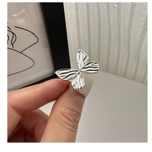 Detailed view of S925 sterling silver bow ring with intricate butterfly wing texture