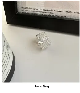 Close-up of S925 sterling silver lace ring with intricate hollowed woven texture